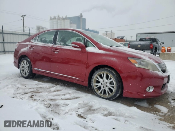 2010 Lexus HS 250h with VIN JTHBB1BA9A2005121, listed as a Copart auction lot 87825175 with 124,594 mi miles and Salvage Title. Bid and sale history available at DreamBid. Image 4.
