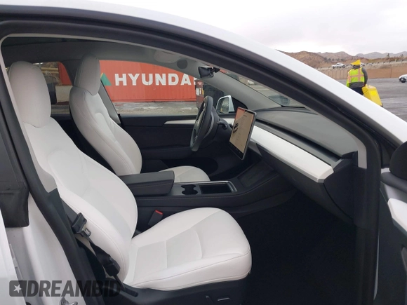2023 Tesla Model Y Long Range with VIN 7SAYGDEE2PF874729, listed as a IAAI auction lot 41518376 with 10,927 mi miles and . Bid and sale history available at DreamBid. Image 5.