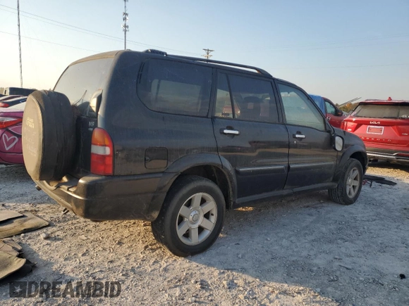 2001 Suzuki XL7 Standard z VIN JS3TX92V514102993, wystawiony jako Copart lot #76669614 z przebiegiem 65 789 mil mil oraz Szkoda całkowita • Salvage title. Historia ofert i sprzedaży dostępna na DreamBid. Obrazek 3.