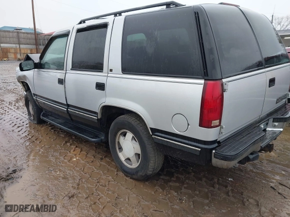 1997 Chevrolet Tahoe with VIN 1GNEK13R0VJ351919, listed as a IAAI auction lot 41028840 with 218,937 mi miles. Bid and sale history available at carsss.com. Image 3.