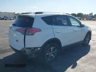 2018 Toyota RAV4 XLE with VIN JTMWFREV3JJ753454, listed as a IAAI auction lot 41775159 with 75,078 mi miles. Bid and sale history available at carsss.com. Image 4.