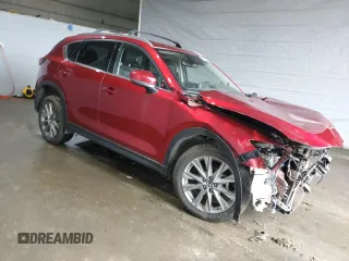2021 Mazda CX-5 Grand Touring with VIN JM3KFBDM8M0434857, listed as a Copart auction lot 47286545 with Not Provided miles and Salvage Title. Bid and sale history available at DreamBid. Image 4.