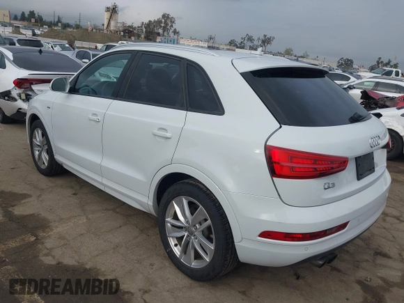 2018 Audi Q3 Premium z VIN WA1BCCFSXJR028356, wystawiony jako IAAI lot #41761544 z przebiegiem 82 877 mil mil oraz . Historia ofert i sprzedaży dostępna na DreamBid. Obrazek 3.