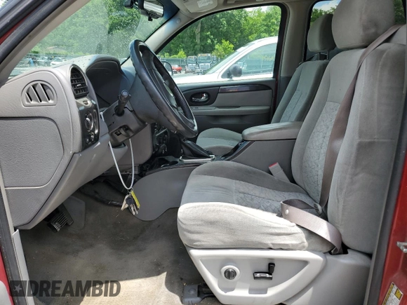 2005 GMC Envoy SLE z VIN 1GKDT13S752203494, wystawiony jako Copart lot #56150605 z przebiegiem 243 475 mil mil oraz Szkody całkowita. Historia ofert i sprzedaży dostępna na DreamBid. Obrazek 7.