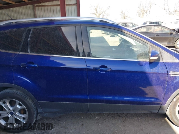 2016 Ford Escape Titanium with VIN 1FMCU9JXXGUB58961, listed as a IAAI auction lot 41772977 with 122,665 mi miles. Bid and sale history available at carsss.com. Image 13.