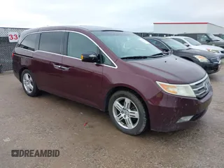 2013 Honda Odyssey Touring with VIN 5FNRL5H90DB048734, listed as a IAAI auction lot 41524502 with 289,556 mi miles and . Bid and sale history available at DreamBid. Image 1.