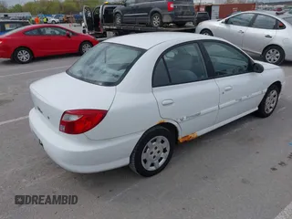 2002 Kia Rio with VIN KNADC123926185376, listed as a IAAI auction lot 42027348 with 84,893 mi miles. Bid and sale history available at carsss.com. Image 4.