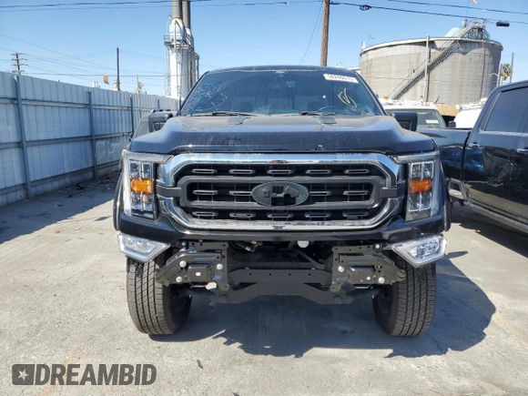 2021 Ford F-150 XL with VIN 1FTFW1E54MFD11453, listed as a Copart auction lot 50240015 with 8,645 mi miles and Salvage title. Bid and sale history available at DreamBid. Image 5.