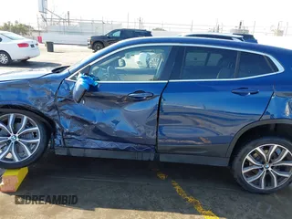 2022 BMW X2 xDrive28i z VIN WBXYJ1C02N5U85241, wystawiony jako IAAI lot #41965012 z przebiegiem 36 262 mil mil oraz . Historia ofert i sprzedaży dostępna na DreamBid. Obrazek 13.