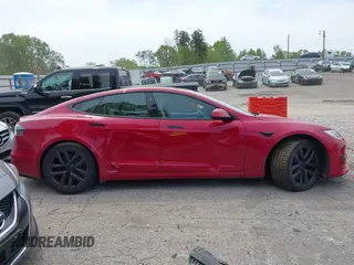 2022 Tesla Model S with VIN 5YJSA1E58NF470737, listed as a IAAI auction lot 42035040 with 15,224 mi miles and . Bid and sale history available at DreamBid. Image 13.