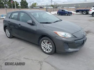 2012 Mazda Mazda3 i Touring with VIN JM1BL1L82C1696088, listed as a IAAI auction lot 41872228 with 111,629 mi miles. Bid and sale history available at carsss.com. Image 1.