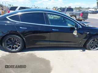 2019 Tesla Model 3 Mid Range with VIN 5YJ3E1EA3KF325056, listed as a IAAI auction lot 41771543 with 183,157 mi miles and . Bid and sale history available at carsss.com. Image 13.