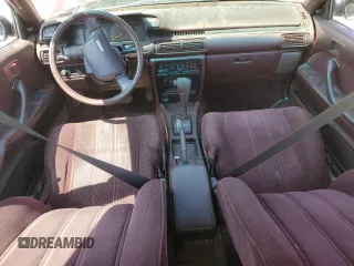 1991 Toyota Camry DLX z VIN 4T1SV21E4MU332100, wystawiony jako Copart lot #64645474 z przebiegiem 164 143 mil mil oraz Czysty tytuł • Clean title. Historia ofert i sprzedaży dostępna na DreamBid. Obrazek 8.