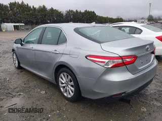 2020 Toyota Camry LE with VIN 4T1C11AK5LU869525, listed as a IAAI auction lot 41693706 with 134,201 mi miles. Bid and sale history available at carsss.com. Image 3.