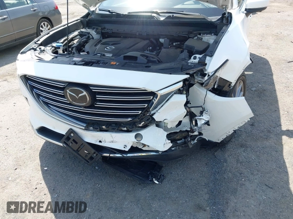 2021 Mazda CX-9 Grand Touring z VIN JM3TCBDY8M0537986, wystawiony jako IAAI lot #42267157 z przebiegiem 25 375 mil mil oraz . Historia ofert i sprzedaży dostępna na DreamBid. Obrazek 6.