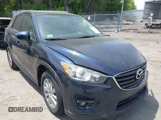 2016 Mazda CX-5 Touring z VIN JM3KE4CY5G0698691, wystawiony jako IAAI lot #42294530 z przebiegiem 88 303 mil mil oraz . Historia ofert i sprzedaży dostępna na DreamBid. Obrazek 1.