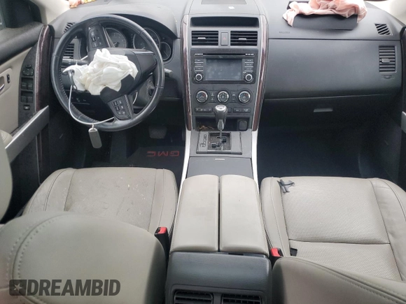 2014 Mazda CX-9 Grand Touring с VIN JM3TB3DA6E0441772, выставлен на аукционе Copart как лот 60832875 с пробегом Не указан миль и На запчасти • Non repairable. История ставок и продаж доступна на DreamBid. Изображение 8.