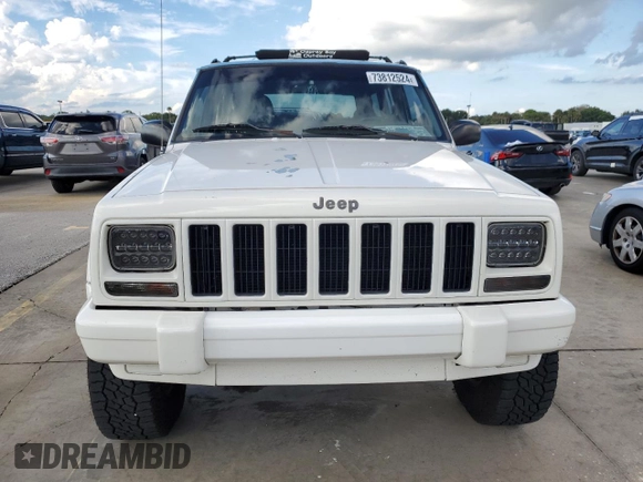 1998 Jeep Cherokee Sport with VIN 1J4FT68S7WL174028, listed as a Copart auction lot 73812524 with 0 mi miles and Salvage Title. Bid and sale history available at carsss.com. Image 5.