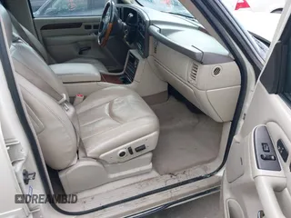 2003 Cadillac Escalade z VIN 1GYEK63N53R304400, wystawiony jako IAAI lot #41544697 z przebiegiem 207 913 mil mil oraz . Historia ofert i sprzedaży dostępna na DreamBid. Obrazek 5.