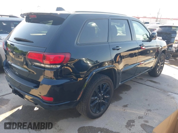 2017 Jeep Grand Cherokee Laredo with VIN 1C4RJFAGXHC817666, listed as a IAAI auction lot 42036817 with 119,698 mi miles. Bid and sale history available at carsss.com. Image 4.