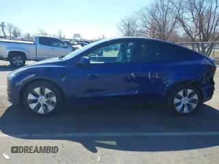2020 Tesla Model Y Long Range with VIN 5YJYGDEF4LF005534, listed as a IAAI auction lot 41830910 with 32,438 mi miles and . Bid and sale history available at DreamBid. Image 13.