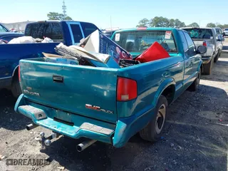 1994 GMC Sonoma with VIN 1GTCS19Z9RK504420, listed as a IAAI auction lot 41695827 with 197,305 mi miles. Bid and sale history available at carsss.com. Image 4.