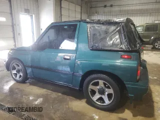 1996 Chevrolet Tracker z VIN 2CNBJ1869T6903842, wystawiony jako Copart lot #87734315 z przebiegiem 120 835 mil mil oraz Szkoda całkowita • Salvage title. Historia ofert i sprzedaży dostępna na DreamBid. Obrazek 2.