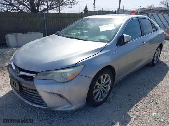 2015 Toyota Camry Hybrid LE with VIN 4T1BD1FKXFU159875, listed as a IAAI auction lot 42041323 with 240,779 mi miles. Bid and sale history available at carsss.com. Image 2.