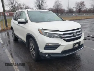 2016 Honda Pilot Touring with VIN 5FNYF6H95GB062089, listed as a IAAI auction lot 41810378 with 74,704 mi miles and . Bid and sale history available at DreamBid. Image 1.