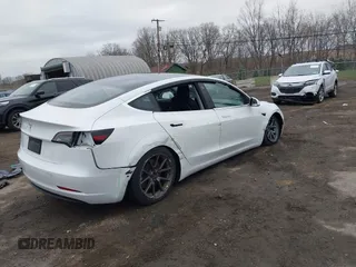 2020 Tesla Model 3 Standard Range Plus with VIN 5YJ3E1EA7LF659172, listed as a IAAI auction lot 42017026 with 32,104 mi miles. Bid and sale history available at carsss.com. Image 4.