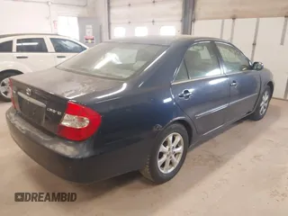 2002 Toyota Camry LE z VIN 4T1BE32K82U626817, wystawiony jako IAAI lot #42157820 z przebiegiem 200 810 mil mil oraz . Historia ofert i sprzedaży dostępna na DreamBid. Obrazek 4.