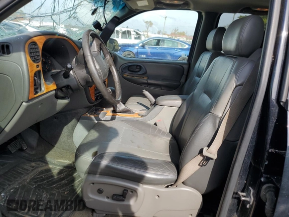 2003 Chevrolet TrailBlazer LTZ with VIN 1GNDT13S332196883, listed as a Copart auction lot 77031124 with 167,328 mi miles and Salvage Title. Bid and sale history available at DreamBid. Image 7.