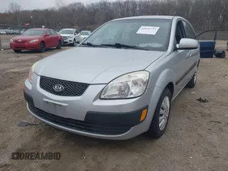 2009 Kia Rio LX with VIN KNADE243596544181, listed as a IAAI auction lot 41876733 with 200,216 mi miles. Bid and sale history available at carsss.com. Image 2.