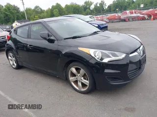 2015 Hyundai Veloster z VIN KMHTC6AD3FU238897, wystawiony jako IAAI lot #42467074 z przebiegiem 89 250 mil mil oraz . Historia ofert i sprzedaży dostępna na DreamBid. Obrazek 1.