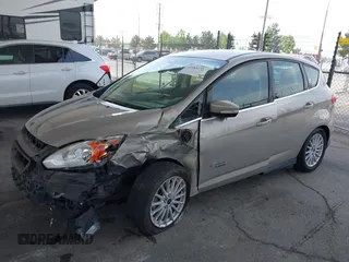 2015 Ford C-Max SEL z VIN 1FADP5CU8FL100255, wystawiony jako IAAI lot #42183172 z przebiegiem 101 606 mil mil oraz . Historia ofert i sprzedaży dostępna na DreamBid. Obrazek 2.