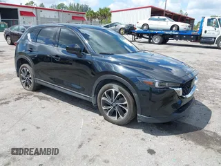 2023 Mazda CX-5 2.5 S Premium Plus Package with VIN JM3KFBEM5P0256652, listed as a IAAI auction lot 41936376 with 31,332 mi miles. Bid and sale history available at carsss.com. Image 1.