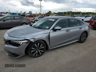 2023 Honda Civic EX z VIN 2HGFE1F71PH324829, wystawiony jako Copart lot #56818365 z przebiegiem 7 821 mil mil oraz Szkoda całkowita • Salvage title. Historia ofert i sprzedaży dostępna na DreamBid. Obrazek 1.