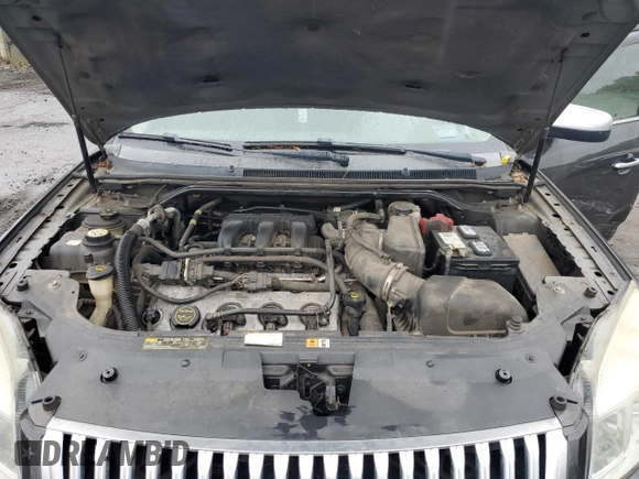 2008 Mercury Sable Premier z VIN 1MEHM43W98G604677, wystawiony jako Copart lot #57840985 z przebiegiem 171 695 mil mil oraz Szkoda całkowita • Salvage title. Historia ofert i sprzedaży dostępna na DreamBid. Obrazek 11.