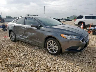 2017 Ford Fusion Hybrid SE with VIN 3FA6P0LU7HR318039, listed as a Copart auction lot 63575325 with 106,355 mi miles and Salvage title. Bid and sale history available at DreamBid. Image 4.