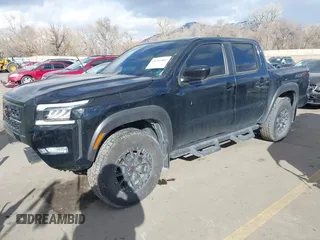 2023 Nissan Frontier SV with VIN 1N6ED1EK0PN658048, listed as a IAAI auction lot 41383407 with 13,744 mi miles and . Bid and sale history available at DreamBid. Image 2.