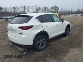 2021 Mazda CX-5 Touring with VIN JM3KFBCM1M1446313, listed as a IAAI auction lot 41930330 with 28,610 mi miles. Bid and sale history available at carsss.com. Image 4.