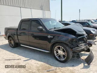 2002 Ford F-150 Harley Davidson with VIN 1FTRW07312KC64714, listed as a Copart auction lot 51275124 with 198,826 mi miles and Non Repairable. Bid and sale history available at carsss.com. Image 4.
