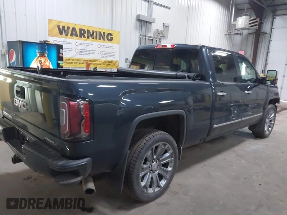2017 GMC Sierra 1500 Denali z VIN 3GTU2PEJ1HG176844, wystawiony jako IAAI lot #42017007 z przebiegiem 185 433 mil mil oraz . Historia ofert i sprzedaży dostępna na DreamBid. Obrazek 4.