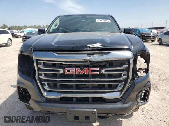 2021 GMC Canyon 4WD AT4 w/Leather with VIN 1GTG6FEN3M1274409, listed as a Copart auction lot 49228145 with 57,194 mi miles and Salvage Title. Bid and sale history available at carsss.com. Image 5.