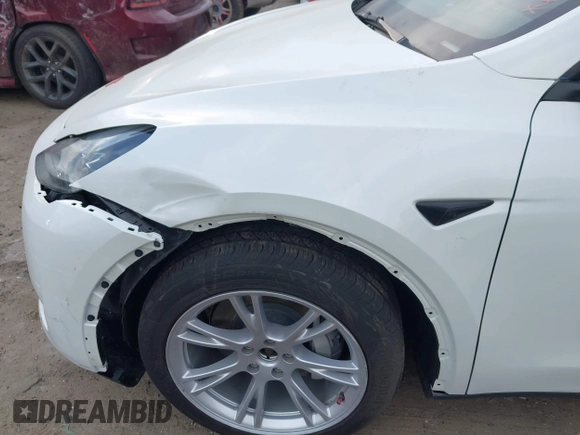 2023 Tesla Model Y Long Range with VIN 7SAYGDEE2PF765395, listed as a IAAI auction lot 41688080 with 27,792 mi miles and . Bid and sale history available at DreamBid. Image 6.