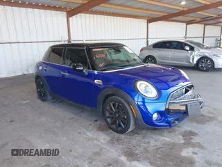 2019 MINI Hardtop 4 Door Cooper S z VIN WMWXU3C56K2H54765, wystawiony jako IAAI lot #42362828 z przebiegiem 35 162 mil mil oraz . Historia ofert i sprzedaży dostępna na DreamBid. Obrazek 1.