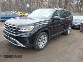 2021 Volkswagen Atlas SEL z VIN 1V2BR2CA6MC502917, wystawiony jako IAAI lot #41681068 z przebiegiem 49 994 mil mil oraz . Historia ofert i sprzedaży dostępna na DreamBid. Obrazek 2.