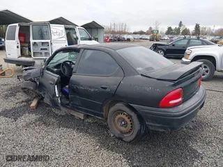 1999 Dodge Neon Competition with VIN 1B3ES47C9XD111397, listed as a IAAI auction lot 41702657 with 210,033 mi miles. Bid and sale history available at carsss.com. Image 3.
