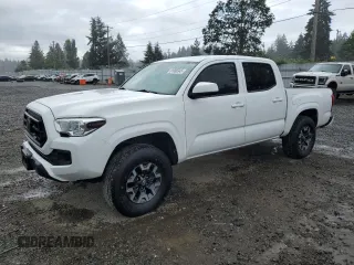 2020 Toyota Tacoma SR5 z VIN 3TMCZ5AN1LM310945, wystawiony jako Copart lot #61086345 z przebiegiem 76 297 mil mil oraz Szkoda całkowita • Salvage title. Historia ofert i sprzedaży dostępna na DreamBid. Obrazek 1.