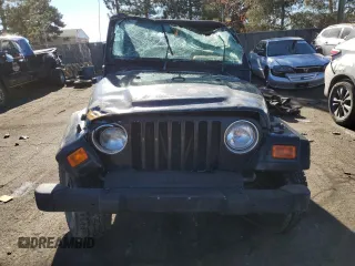 2000 Jeep Wrangler SE with VIN 1J4FA29P8YP727063, listed as a Copart auction lot 89113555 with 91,032 mi miles and Salvage Title. Bid and sale history available at carsss.com. Image 5.